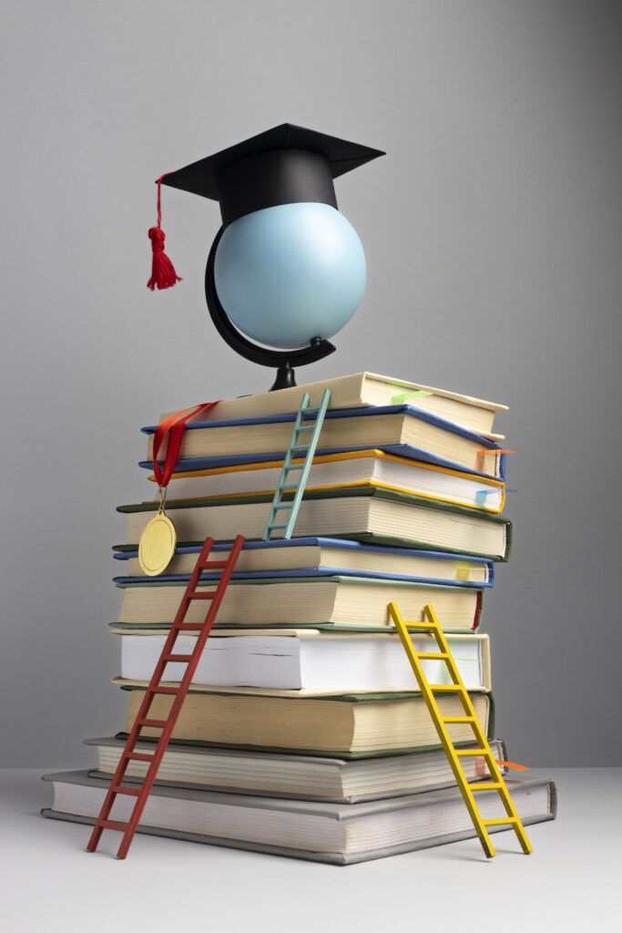 front-view-stacked-books-graduation-cap-ladders-education-day